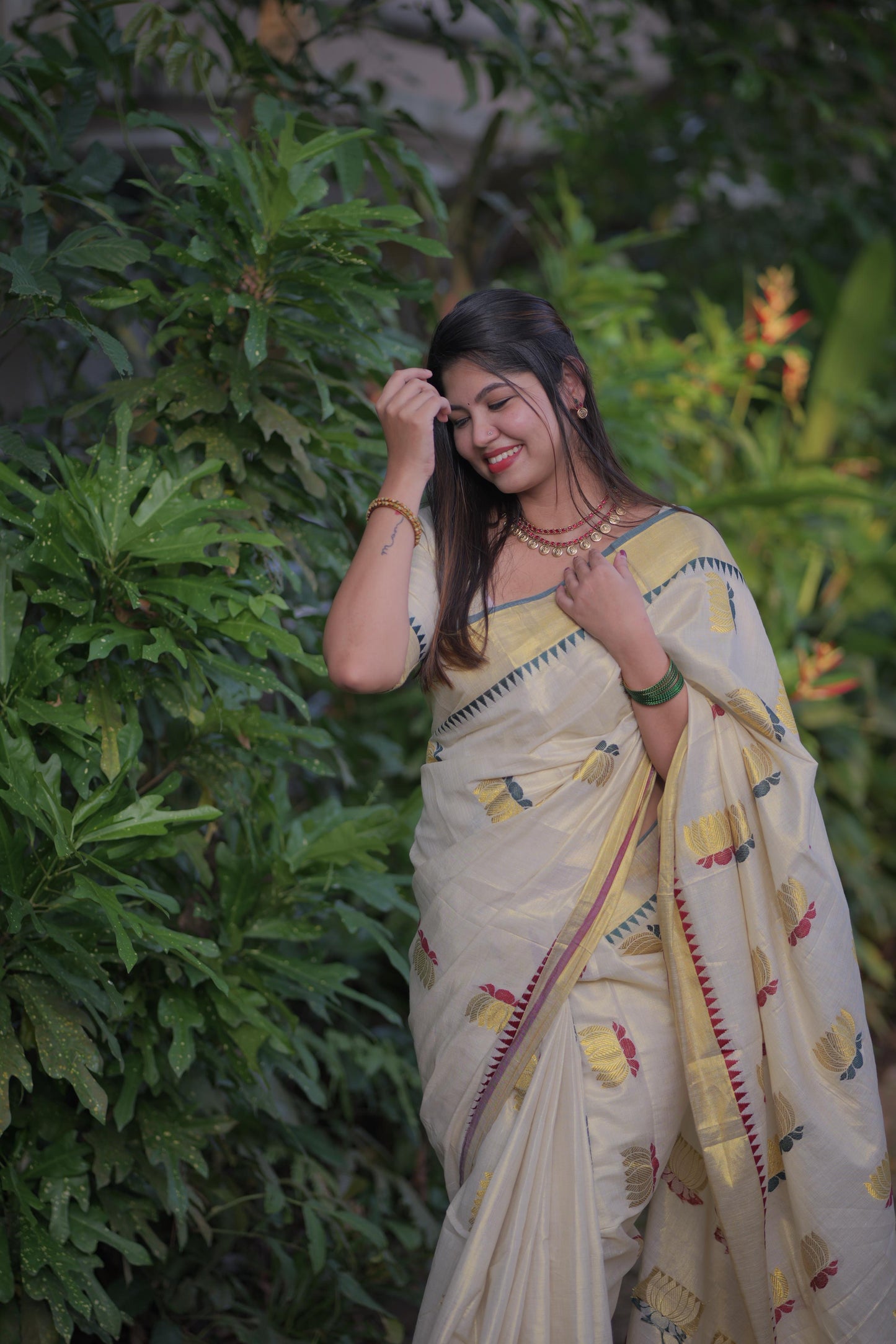 Golden tissue multi colour lotus motif Saree