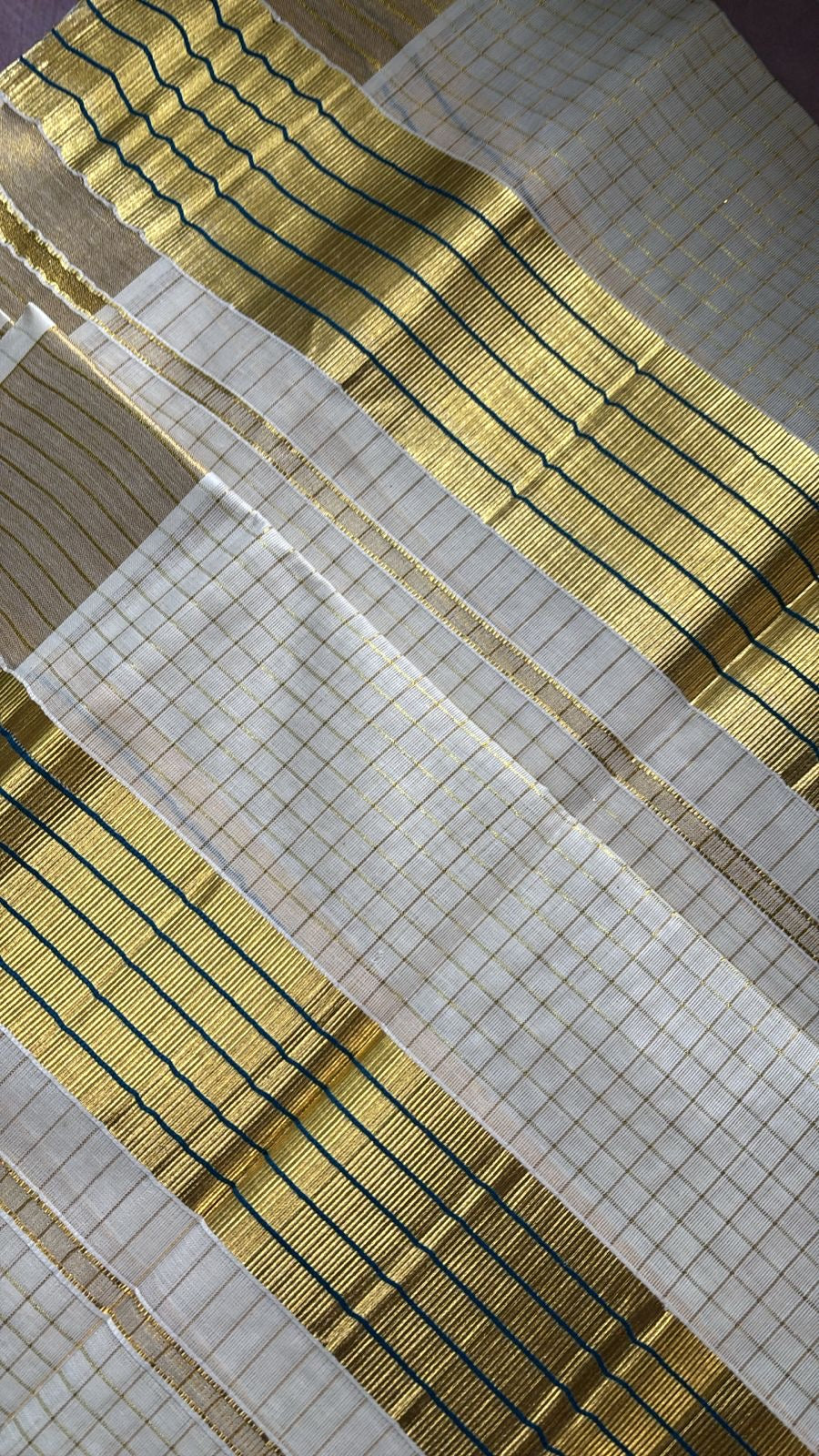 Sarvani Golden Tissue zari checks kasavu with blue kara Set Mundu