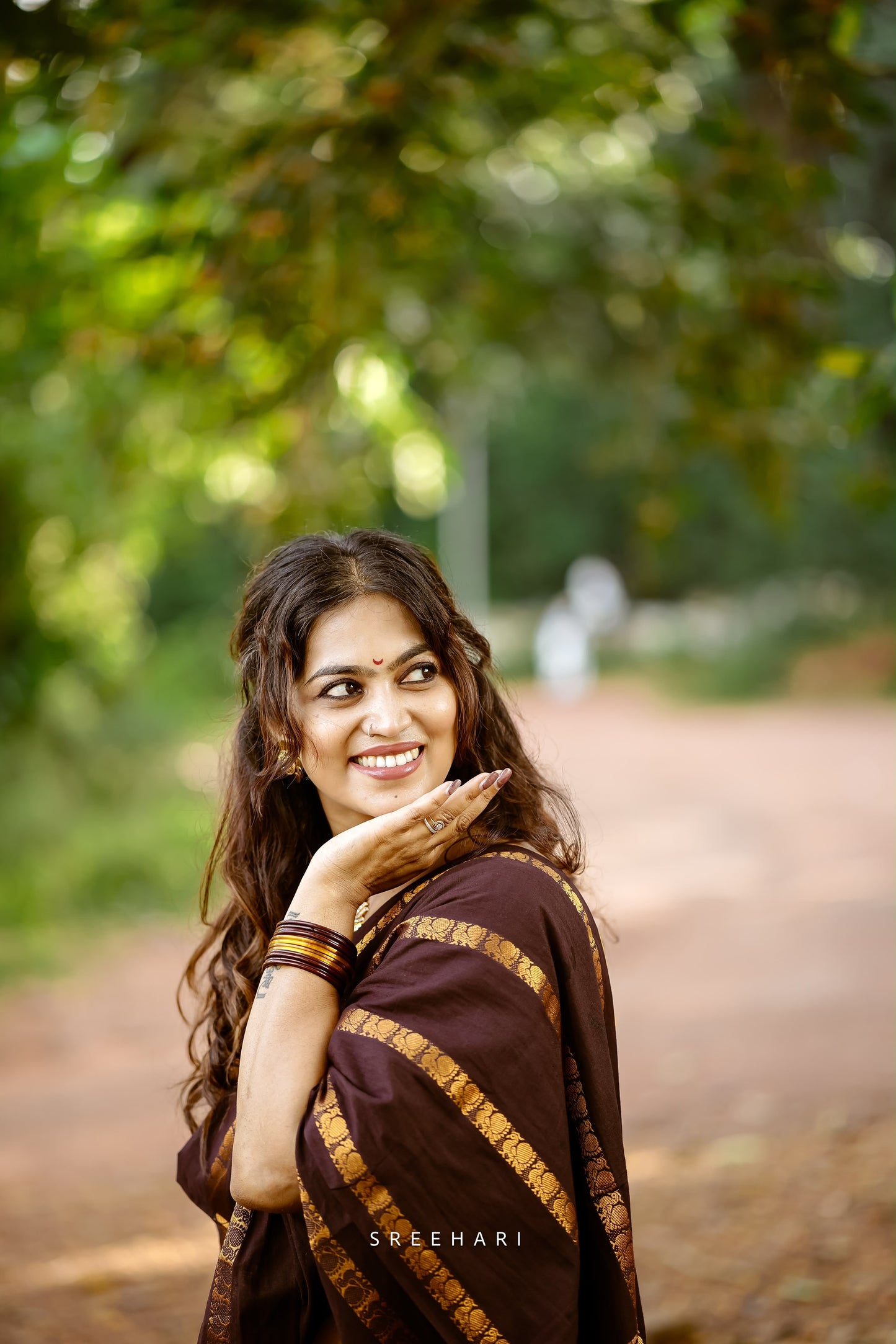 Mayil Velthari Sungudi brown saree with mustard blouse