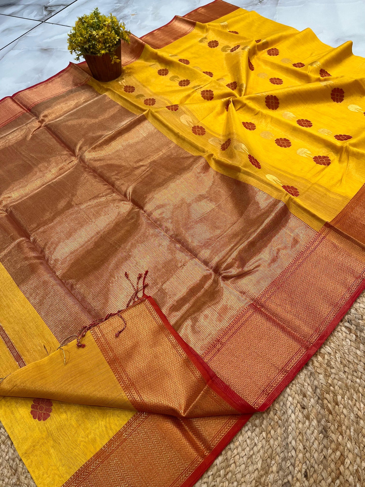 Festive yellow Maheshwari handloom tissue floral butta Saree