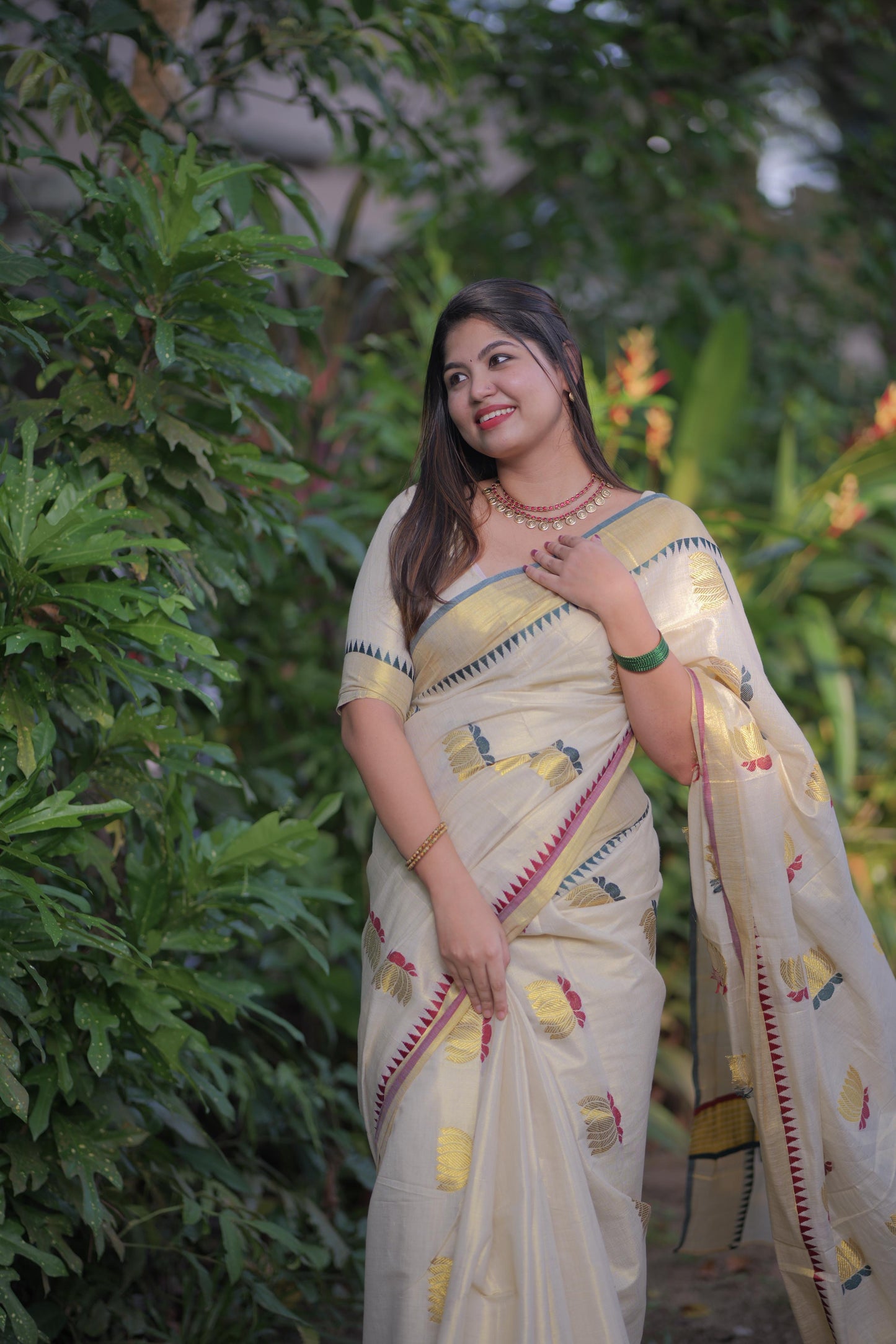 Golden tissue multi colour lotus motif Saree