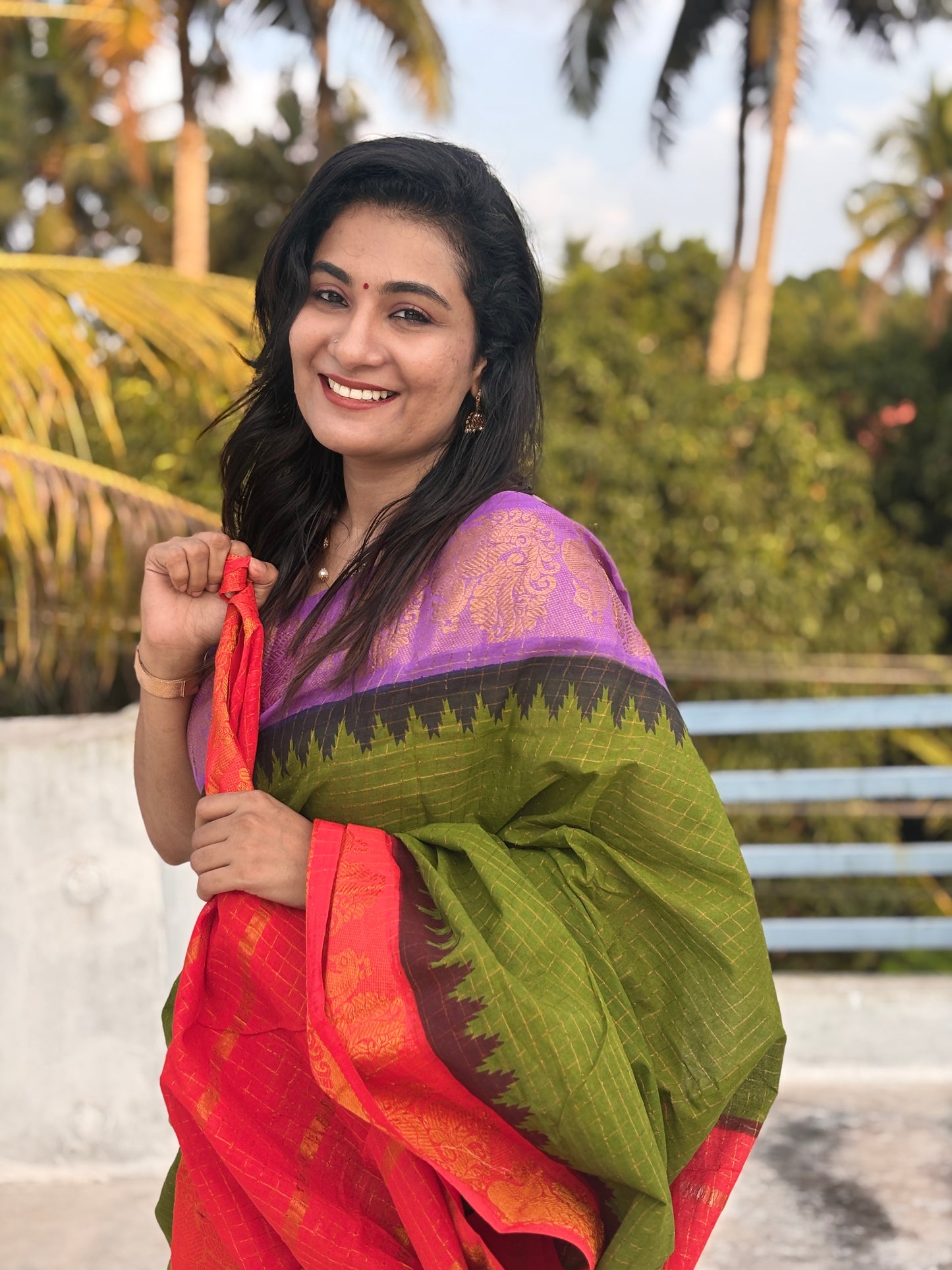 Green body Ganga Jamuna Sungudi Saree with violet and red temple borders