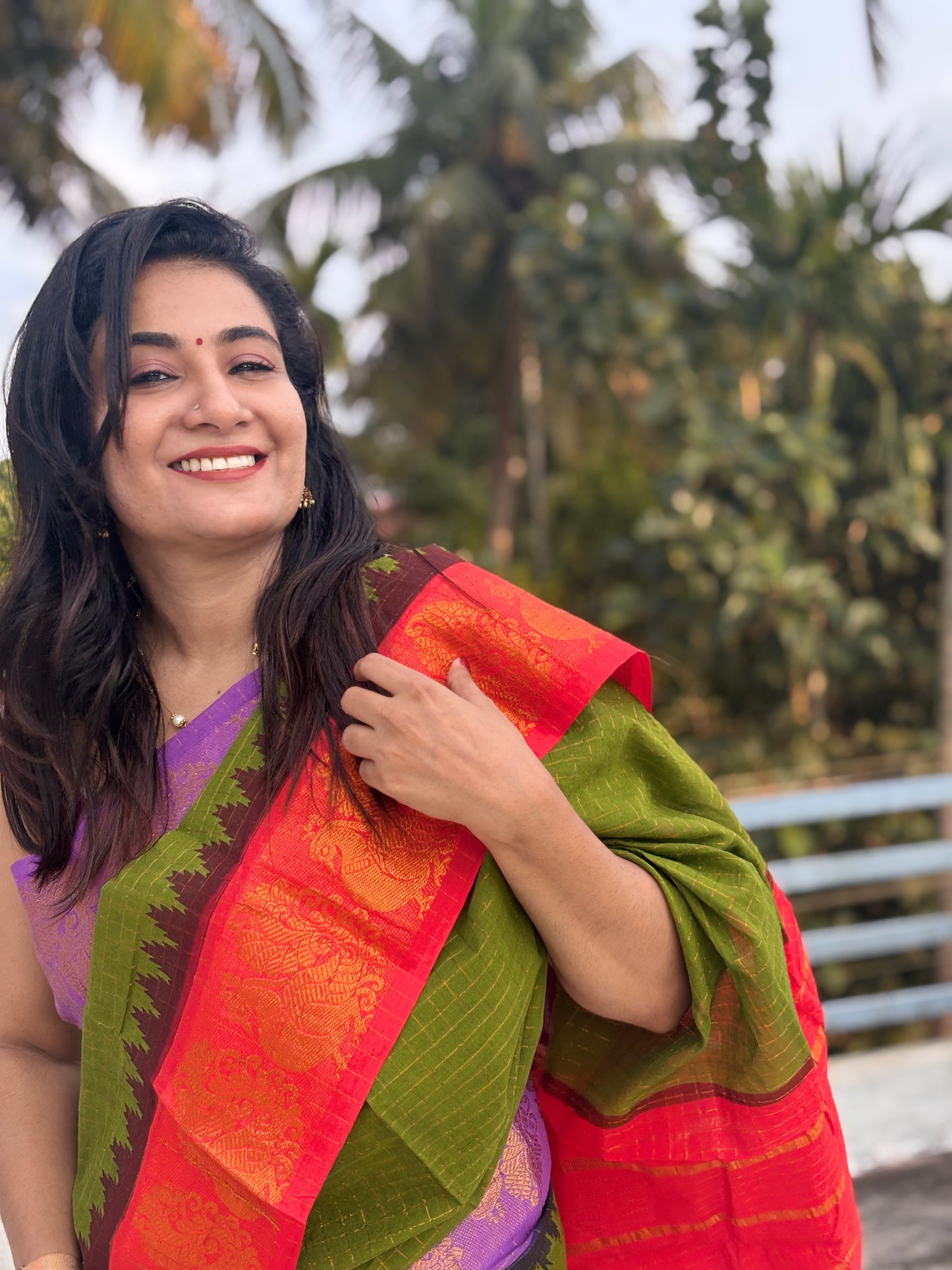 Green body Ganga Jamuna Sungudi Saree with violet and red temple borders