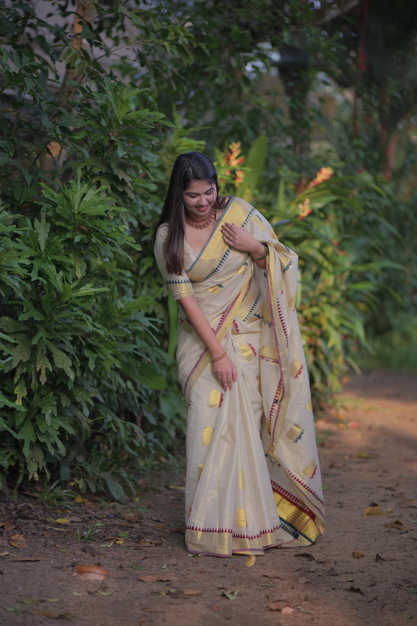 Golden tissue multi colour lotus motif Saree