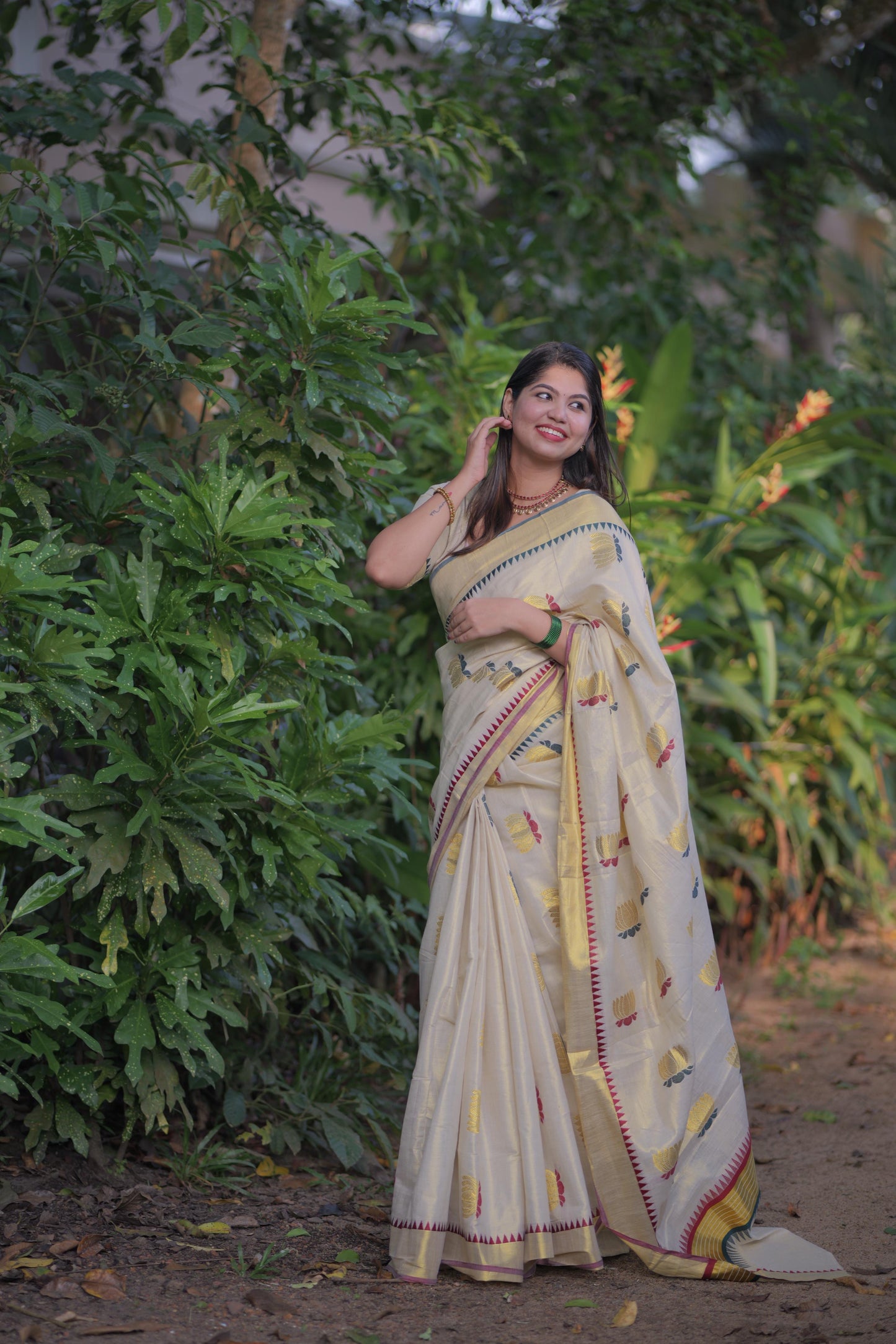 Golden tissue multi colour lotus motif Saree