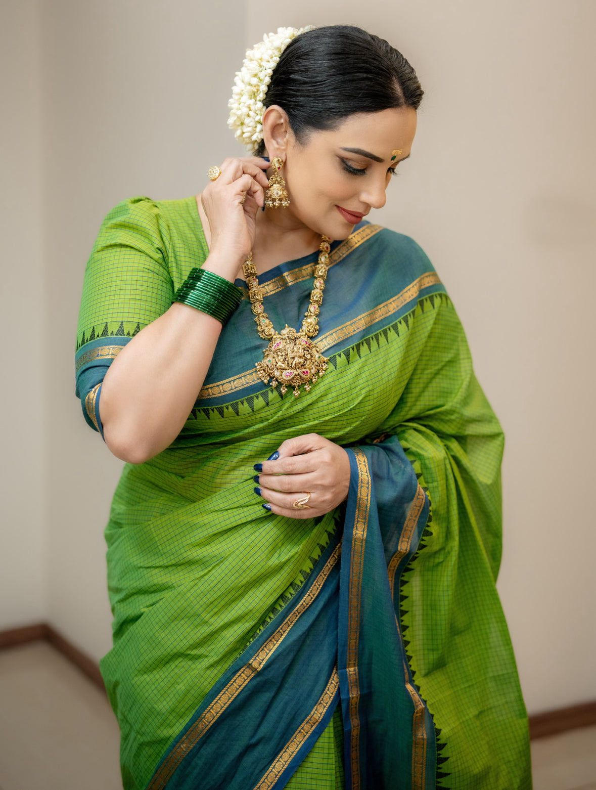 Sangita vintage korvai checks green saree with contrast border Shwetha Menon’s choice